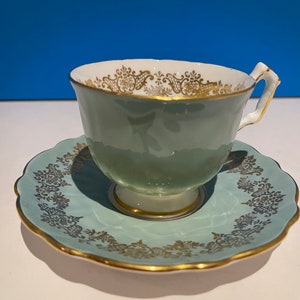 Vintage Embossed Aynsley teacup and saucer. Sage colour decorated with golden pattern