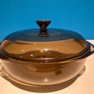Pyrex amber glass casserole dish with a lid