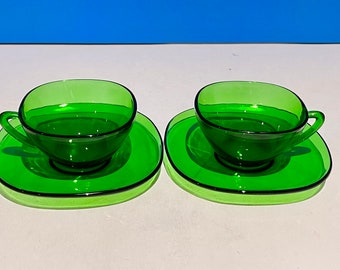 Set of two Vereco green glass espresso cups with saucers. Made in France Mid Century Modern.