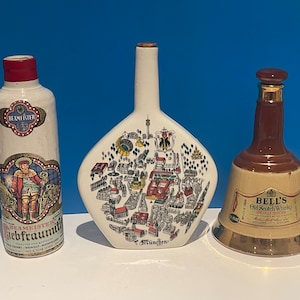 Set of 3 vintage bottles: Anton Riemerschmid Escorial Grun,  Beameister Ziebframitch and Bell&#39;s Old Scitch Whisky bottle.