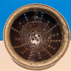 Hand made ceramic straining berry bowl or colander.