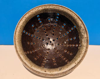Hand made ceramic straining berry bowl or colander.