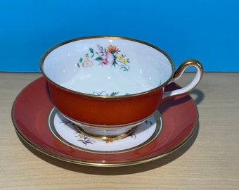 Royal Chelsea orange teacup and saucer , decorated with gold and flowers
