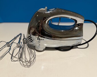 Vintage Oster Handheld electric mixer, a 6 speed model with chrome finish.