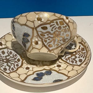 Vintage eggshell quality handpainted teacup and saucer made in Japan.