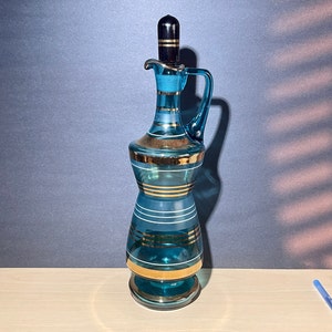 Mid Century Bohemian blue glass decanter decorated with gold stripes