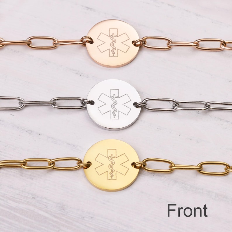 May include: Three medical alert bracelets in rose gold, silver, and gold. Each bracelet features a circular pendant with the Star of Life symbol and a chain link band. The word "Front" is printed at the bottom.