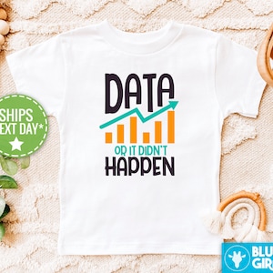 May include: White t-shirt with the text "DATA OR IT DIDN'T HAPPEN" in black, teal, and orange. The design includes a teal line graph with an upward arrow and orange bar graphs. A fun, graphic tee for data enthusiasts.