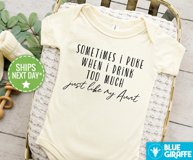 May include: A white baby onesie with black text that reads "Sometimes I puke when I drink too much just like my Aunt".