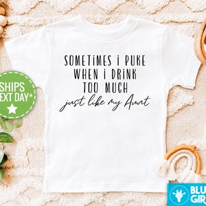 May include: White t-shirt with black text that reads "Sometimes I puke when I drink too much just like my Aunt".