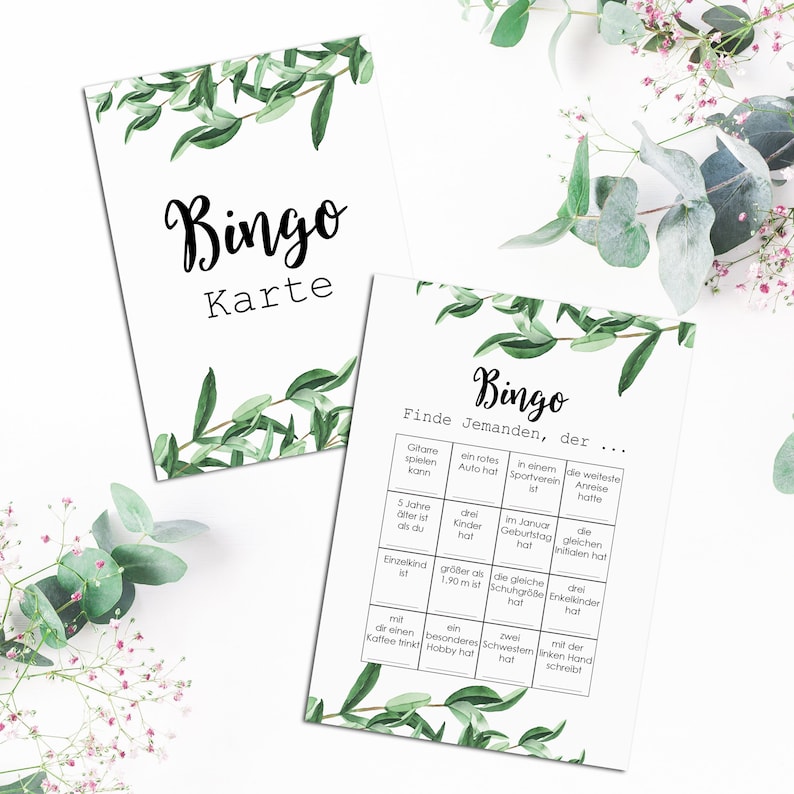 May include: Bingo game card with a green leafy background. The card has a grid with various prompts like "Find someone who has a red car" and "Find someone who is taller than 1.90 m".