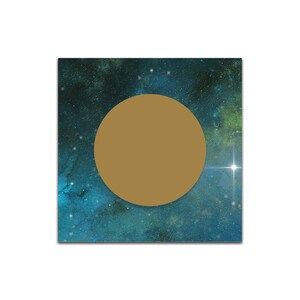 May include: A gold circle on a blue and green galaxy background with white stars.