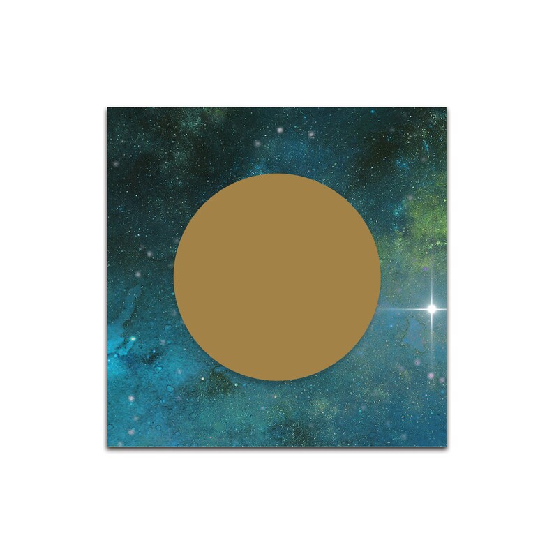 May include: A gold circle on a blue and green galaxy background with white stars.