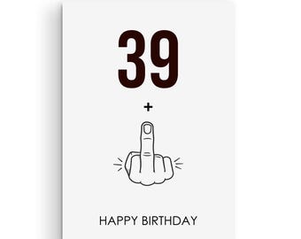 May include: A white card with black text that says "39" and a plus sign. Below the plus sign is a black and white illustration of a middle finger. The text "Happy Birthday" is at the bottom of the card.