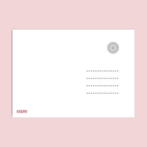 May include: A white postcard with a black and white mandala design in the upper right corner. The text "NASTAMI" is printed in red at the bottom of the card.