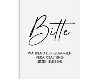 May include: A white rectangular sign with black text. The word "Bitte" is written in a cursive font at the top. Below, the text reads "WÄHREND DER GESAMTEN VERANSTALTUNG SITZEN BLEIBEN!"