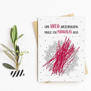 May include: A white card with black polka dots and the text "Um Stress abzubauen, male ich Mandalas aus." A red scribble fills in a black and white mandala design.