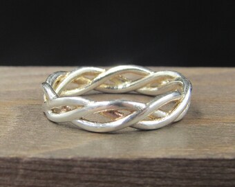 May include: A silver braided ring with a smooth, polished finish.