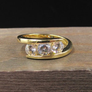 Size 7 Gold Over Sterling Silver Triple Clear Gem Cubic Zirconia Band Ring