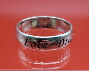 Seeing silver ring in dream hot sale