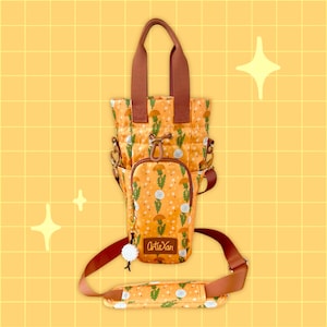 May include: A brown and orange tote bag with a dandelion print and the text "Arti&Yan". The bag has a brown strap and a zipper closure.