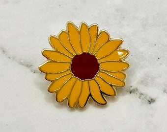 Broche en émail de tournesol avec un léger défaut