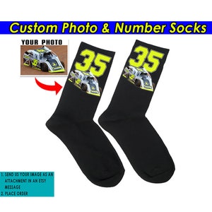 May include: A pair of black socks with a custom photo and number. The photo shows a race car with the number 35 on it. The socks are a great way to show your support for your favorite driver.