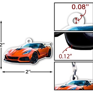 May include: Orange Chevrolet Corvette C8.R car keychain, 2 inches wide and 2 inches tall. The keychain is made of durable plastic and features a detailed design of the car. The keychain has a small hole at the top for attaching to a key ring.