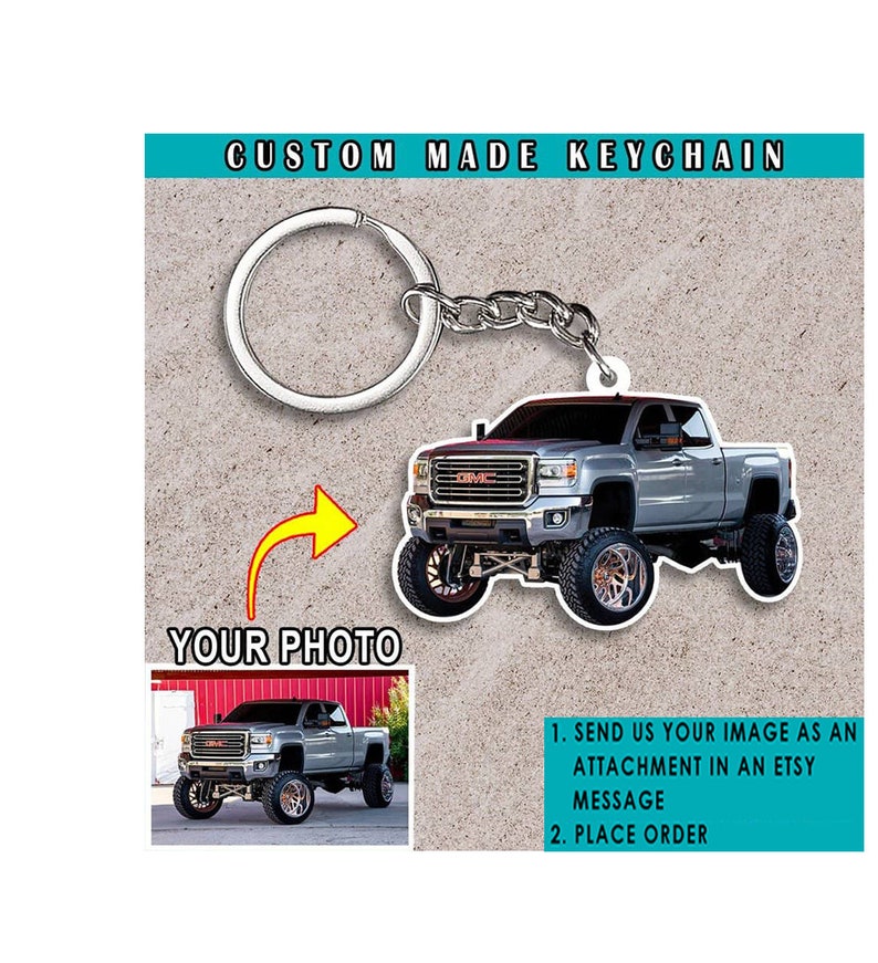 May include: Custom made keychain featuring a silver pickup truck with a black grille and large wheels. The keychain is attached to a silver key ring and chain. The image includes instructions to send a photo to be used for the keychain.