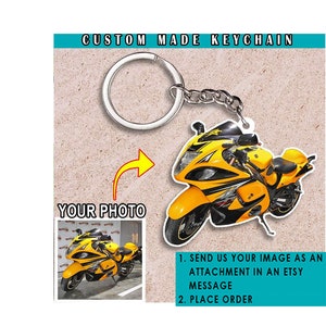 May include: A yellow and black custom-made keychain featuring a motorcycle. The keychain is attached to a silver key ring. The image includes instructions to send a photo to be used on the keychain.