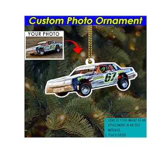 May include: A custom photo ornament featuring a race car with the number 67 on the side. The ornament is white with a clear background and is ready to be personalized with your own photo.
