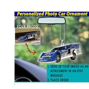 May include: A blue and white race car ornament with a chain for hanging. The car has the word "Valvoline" on the side and the number "1" on the roof. The ornament is a personalized photo car ornament, and the instructions are to send an image as an attachment in an Etsy message and then place an order.