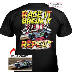May include: A black t-shirt featuring a graphic of a race car with the number 67, checkered flags, and the text "RACE IT BREAK IT FIX IT REPEAT" in yellow and red. A smaller inset image shows the original race car photo used for the design.