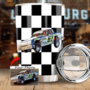 May include: A stainless steel tumbler with a black and white checkered pattern. The tumbler features a race car with the number 67. The lid is silver and the tumbler has a small photo of the race car.