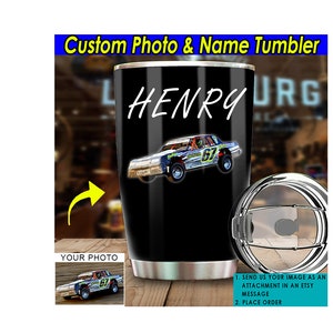 May include: A black stainless steel tumbler with a custom photo and name. The tumbler features a racing car image and the name "HENRY".