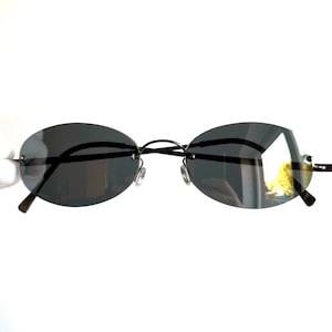 LINDBERG Spirit Titanium P70 Sonnenbrille oval randlos rahmenlos Leichtgewicht Neu dunkel verspiegelt Messing silberfarben schmal kleiner Rahmen Matrix