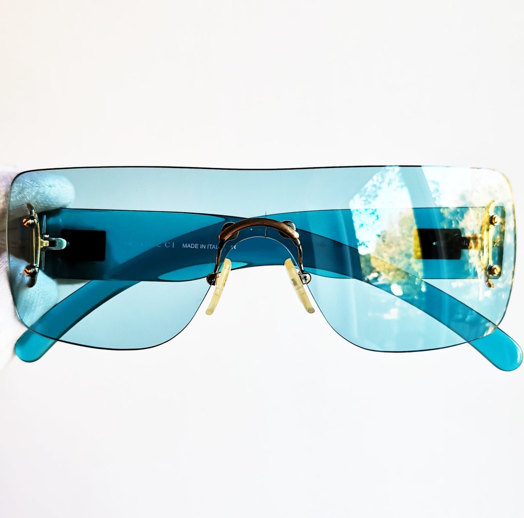 Chanel sunglasses with blue square frames and brown transparent lenses