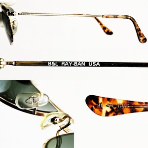 May include: Close-up of Ray-Ban sunglasses with a gold frame and green lenses. The temples have a tortoiseshell pattern. The text "B&L RAY-BAN USA" is printed on the temple. The nose pads are clear.
