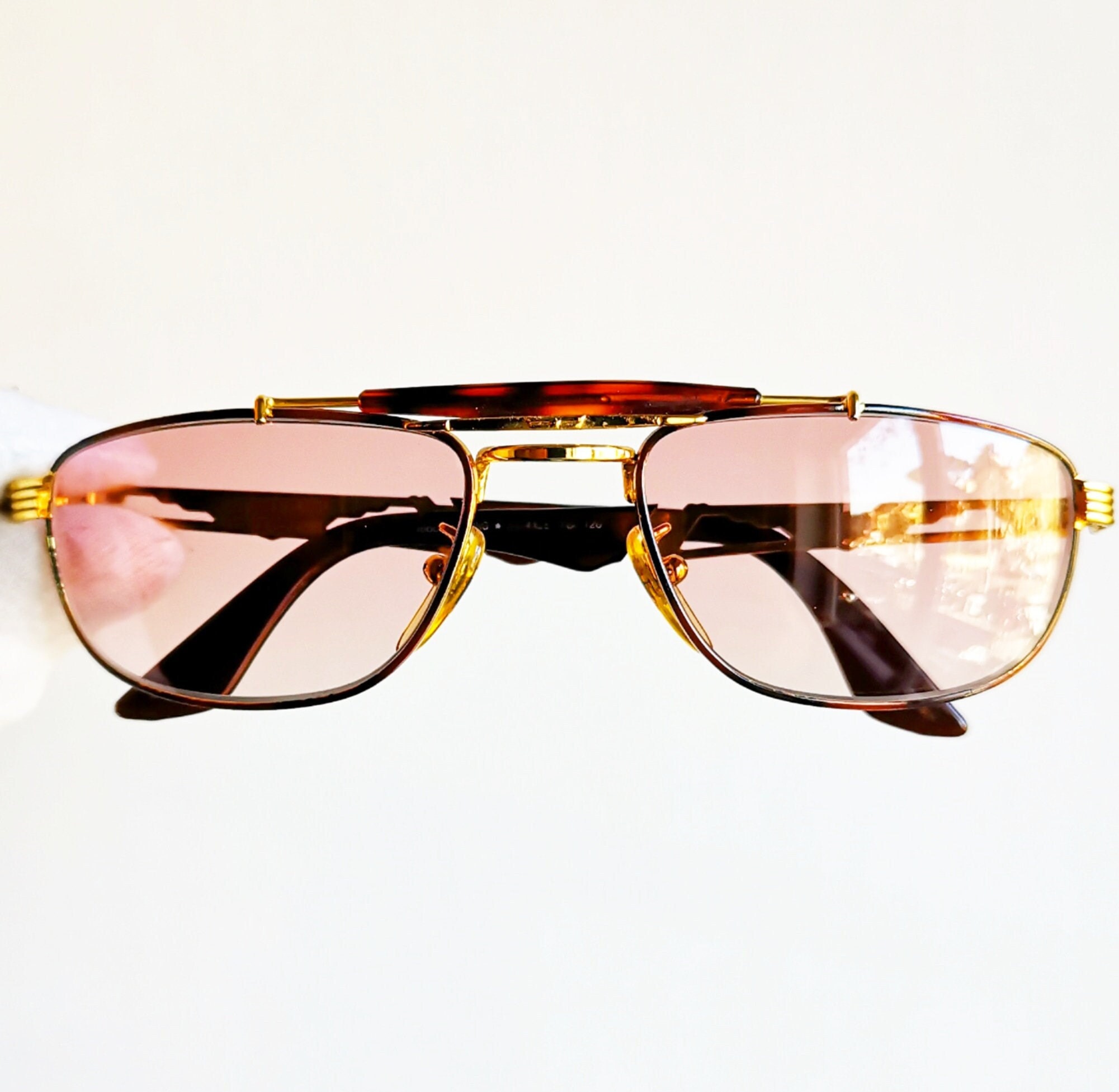 Explore a Chanel Vintage Brown 4125 Rimless CC Logo Shield