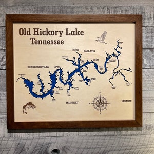 May include: A wooden map of Old Hickory Lake, Tennessee, with a blue lake outline and a compass rose. The map includes the names of towns and creeks surrounding the lake.
