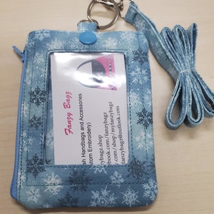 Monedero con llavero y cordón para la muñeca con estampado de copos de nieve súper lindo