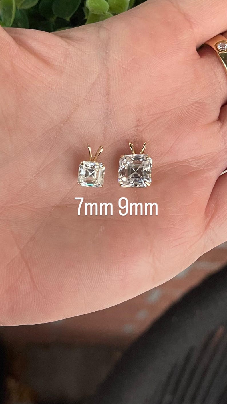 May include: Two square-shaped diamond pendants on a gold chain, one is 7mm and the other is 9mm.