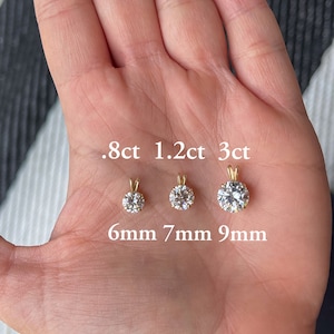 May include: Three round diamond pendants of different sizes, 0.8ct, 1.2ct, and 3ct, with corresponding measurements of 6mm, 7mm, and 9mm.