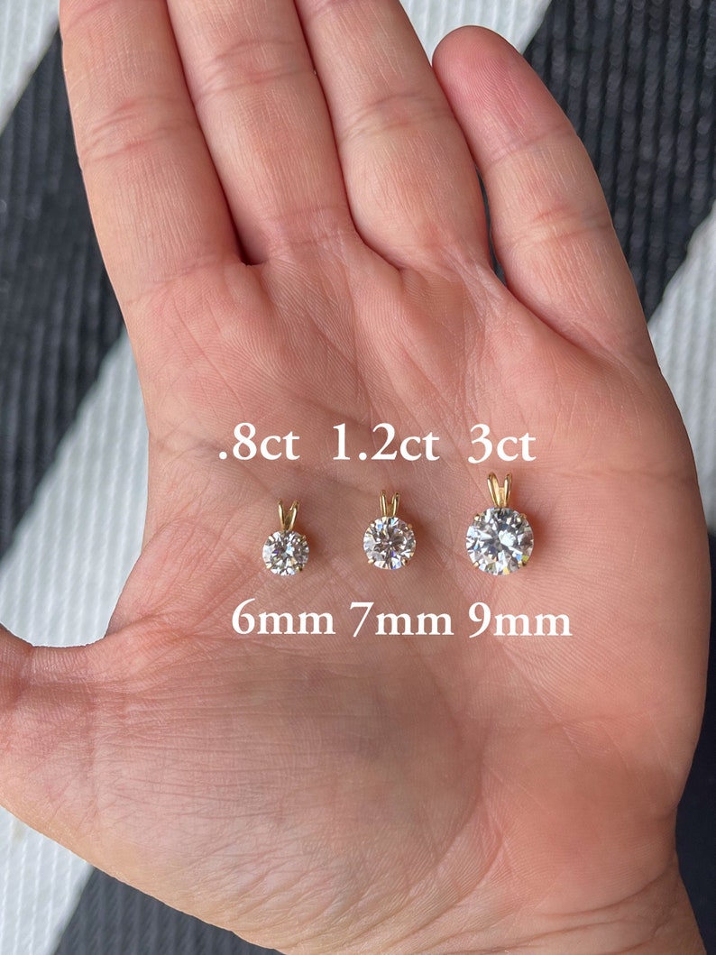 May include: Three round diamond pendants of different sizes, 0.8ct, 1.2ct, and 3ct, with corresponding measurements of 6mm, 7mm, and 9mm.