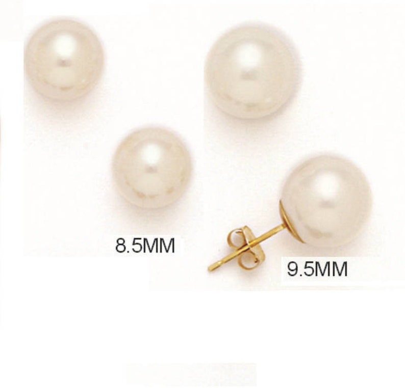 May include: Four ivory-colored pearl stud earrings. Two pearls are 8.5mm in diameter, and one earring is shown with a gold post and a 9.5mm pearl. The earrings are displayed on a white background.