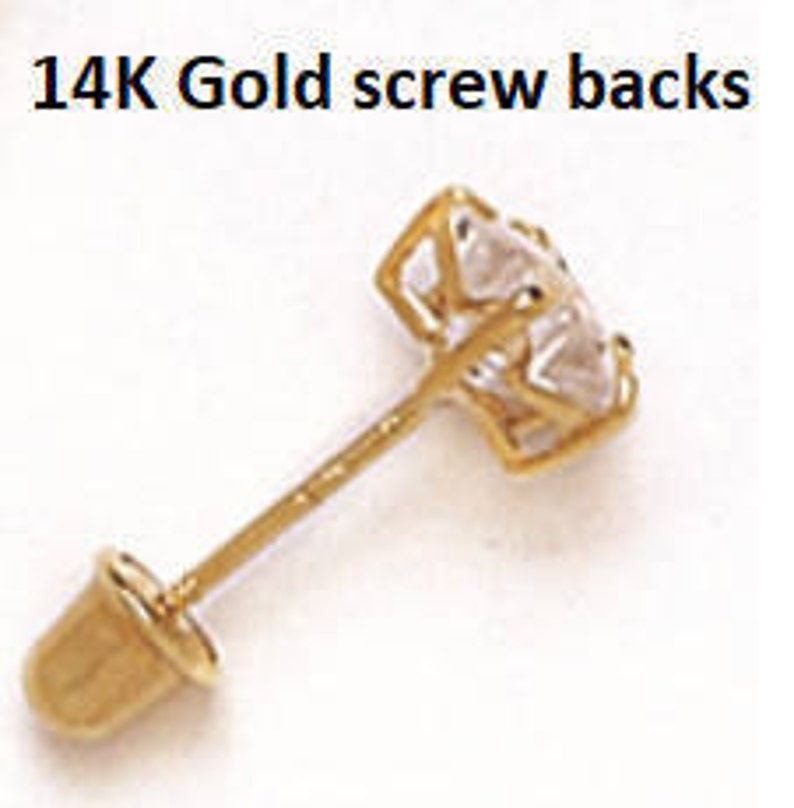 May include: 14K gold screw back earring findings. The screw back is gold and has a small, round, flat top. The post is gold and has a small, round, flat bottom.