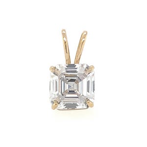 May include: A clear, square-cut gemstone pendant with a gold-coloured bail. The gemstone is faceted, reflecting light. The pendant is set in a gold-coloured metal setting, a classic jewellery design.