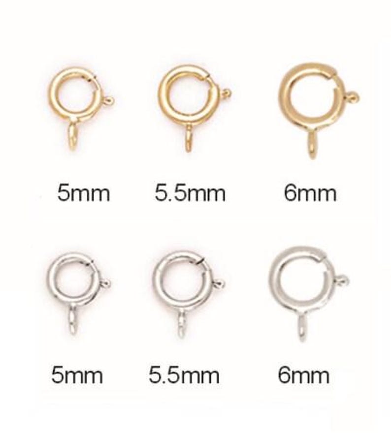 May include: Six gold and silver jump rings, each with a spring clasp. The rings are 5mm, 5.5mm, and 6mm in diameter.