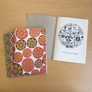 A handmade book of love poems. | A little book of love language.