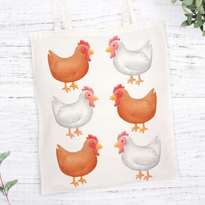May include: A white tote bag with six illustrated chickens. Three chickens are brown and three are white. The chickens are facing forward and have red combs.